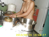 Chinese couple nude in kitchen