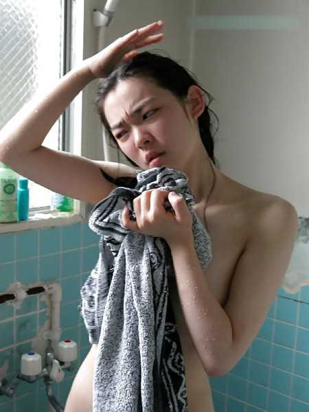 Chinese girl taking a shower